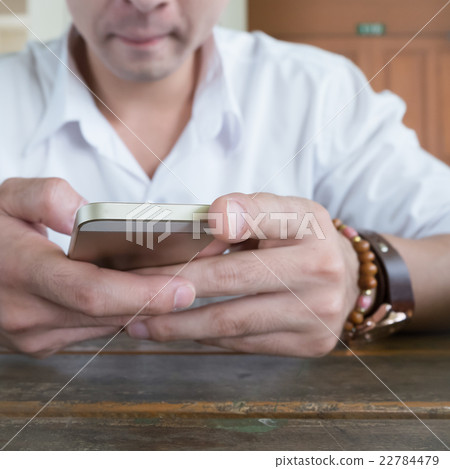 businessman using a mobile phone businessman using a mobile phone 22784479