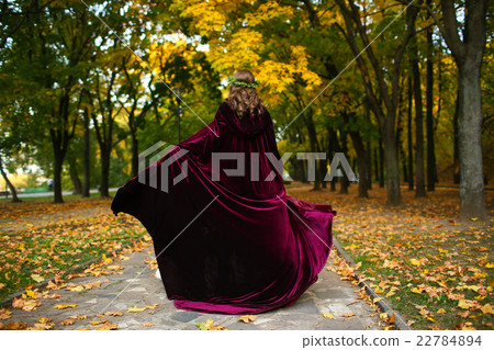 Beautiful girl with lantern in the scary autumn 22784894