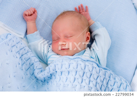Newborn baby boy in white bassinet 22799034