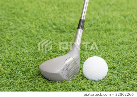Golf ball and golf club on green grass Golf ball and golf club on green grass 22802266
