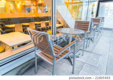 Tables and chairs in restaurant 22805403