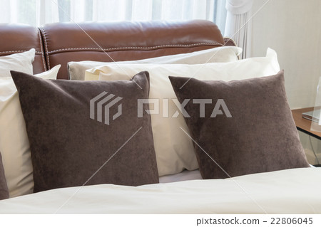 modern bedroom with brown pillows and lamp modern bedroom with brown pillows and lamp 22806045