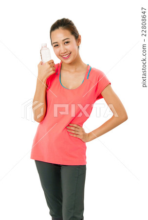 Asian woman in fitness wear with bottle of water. 22808647