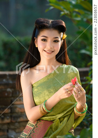 Beautiful woman wearing in Thai traditional costume ,woman sitti Beautiful woman wearing in Thai traditional costume ,woman sitti 22808657