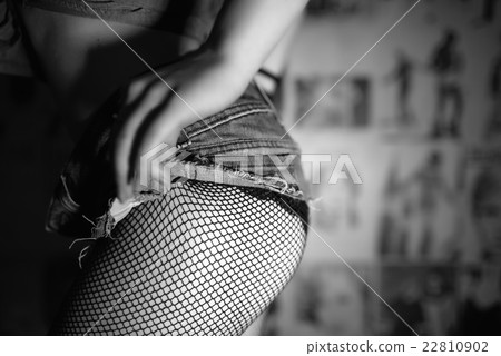Female butt in short jeans shorts and tights 22810902