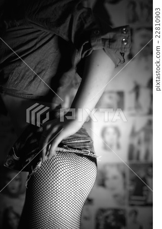 Female butt in short jeans shorts and tights Female butt in short jeans shorts and tights 22810903
