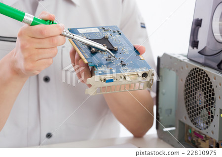 Men who repair personal computers Men who repair personal computers 22810975