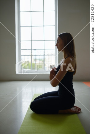 Young girl does stretching yoga exercise Young girl does stretching yoga exercise 22811429