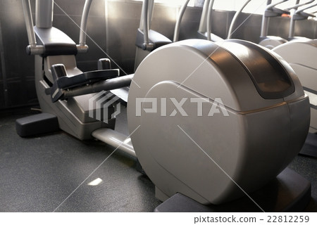 Elliptical cross trainer in modern fitnes club 22812259