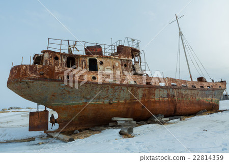 Old rusty ship on winter shore of Lake Baikal. 22814359