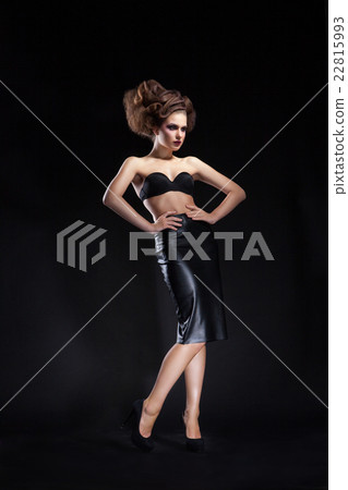 Vogue model posing against of black background Vogue model posing against of black background 22815993