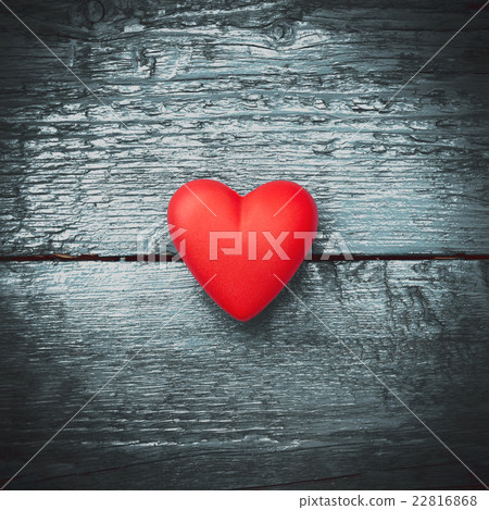 Red heart on the dark boards 22816868