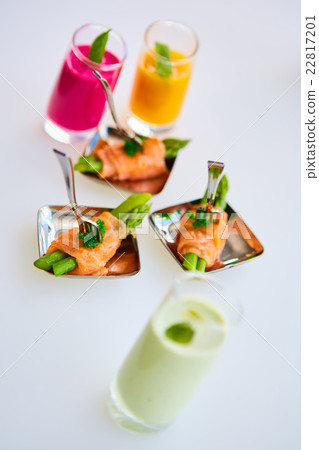 Appetizer plate of sauteed asparagus wrapped in 22817201