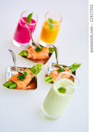 Appetizer plate of sauteed asparagus wrapped in 22817202