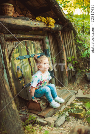 Girl near tiny house 22817453
