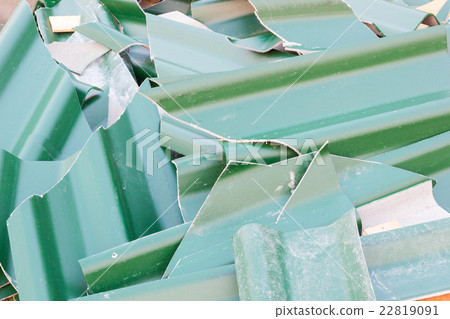 Pile of old green broken roofing tiles closeup 22819091