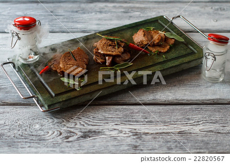 Tray with cooked meat. 22820567