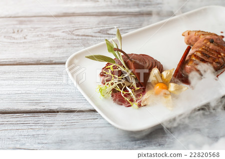 Pieces of meat with herbs. 22820568