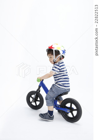 Infants playing with a strider 22822513