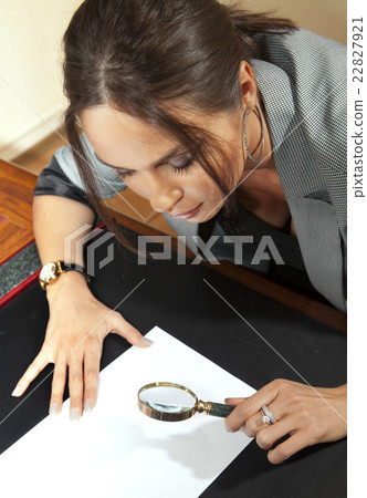 woman looks on document woman looks on document 22827921