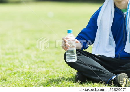 A young man with a plastic bottle 22829071