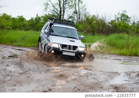 Mitsubishi Pajero moving by water making splashes 22835777