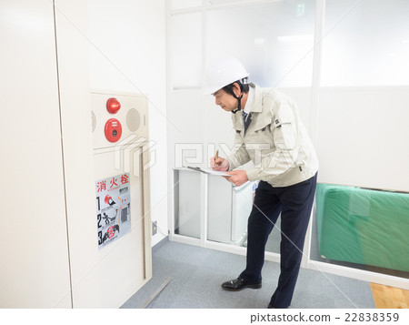 Workers inspecting fire hydrant Workers inspecting fire hydrant 22838359