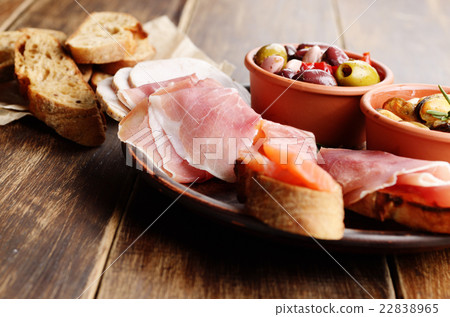 Tapas of salmon, mussels, jamon and olives 22838965