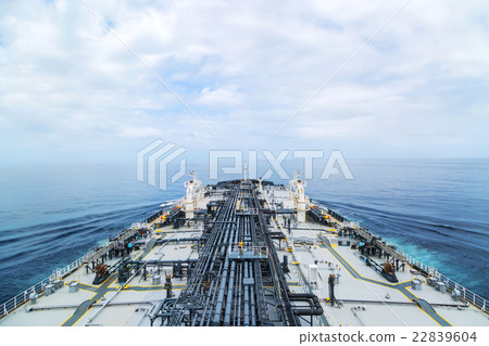 Big grey oil tanker underway in the open sea. Big grey oil tanker underway in the open sea. 22839604