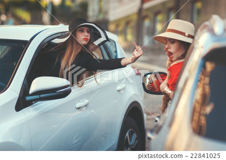 Woman insults another driver. 22841025