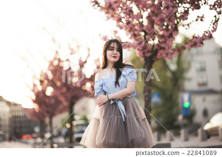 Young Asians girl with modern dress posing in an Young Asians girl with modern dress posing in an 22841089