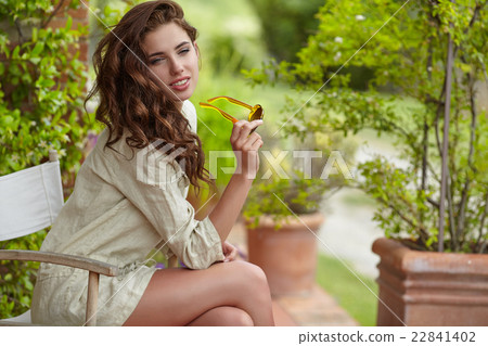 Woman smiling happy on sunny summer day outs Woman smiling happy on sunny summer day outs 22841402