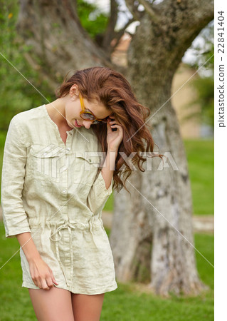 Woman smiling happy on sunny summer day outs 22841404