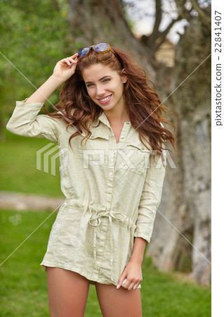 Woman smiling happy on sunny summer day outs 22841407