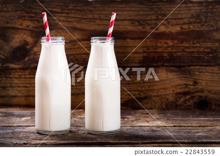 bottles of milk with straws bottles of milk with straws 22843559
