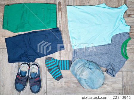 Flat lay photography of some boy's casual outfits. 22843945