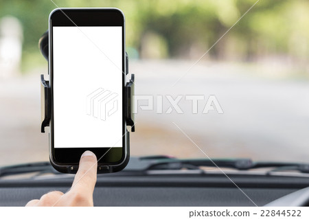 close up hand use phone on mount in car 22844522