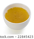 A bowl of clear chicken broth 22845423