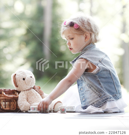 Girl playing with teddy bear Girl playing with teddy bear 22847126