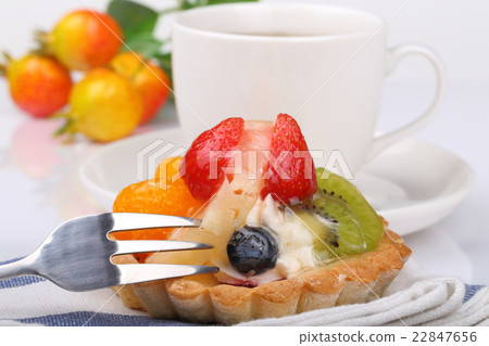 One fruit cake and teacup 22847656