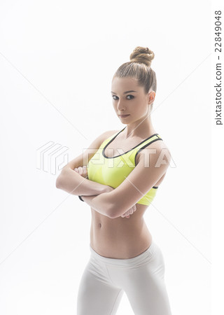 Beautiful slim sportswoman is posing in sportswear Beautiful slim sportswoman is posing in sportswear 22849048