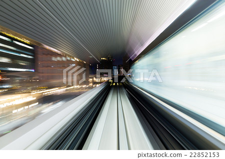 Fast train through city Fast train through city 22852153