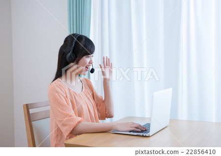 School girls in private clothes (PC, Internet learning, headset) 22856410