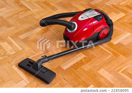 Vacuum cleaner on parquet Vacuum cleaner on parquet 22858095