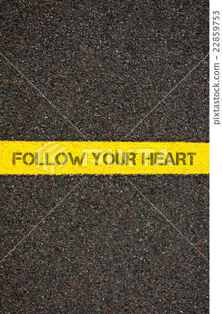 Road marking yellow line words FOLLOW YOUR HEART Road marking yellow line words FOLLOW YOUR HEART 22859753