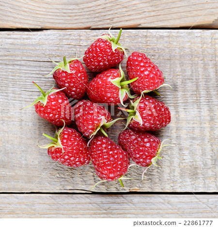 Raspberries on wooden table top view Raspberries on wooden table top view 22861777