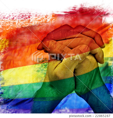 rainbow flag and man hands praying 22865287