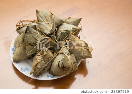 Traditional Duanwu Chinese rice dumplings on plate 22867919