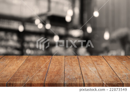 Wooden tabletop with sepia coffee shop blurred 22873549