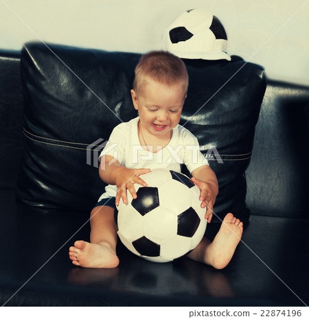 Little boy flaying with football 22874196